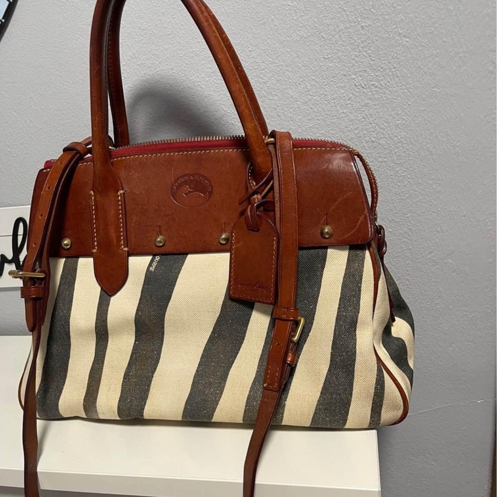 Dooney and Bourke zebra cross body purse. Leather upper and straps